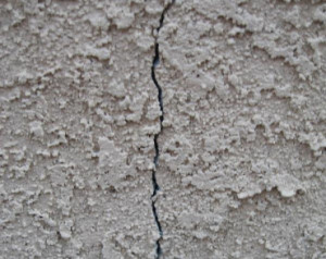 Cracks allow water to penetrate into the wood structure below.